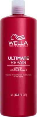 A red bottle of Wella Professionals Ultimate Repair Shampoo.