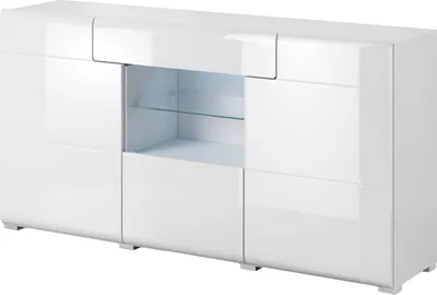 A white, modern sideboard with glass shelves and interior lighting.