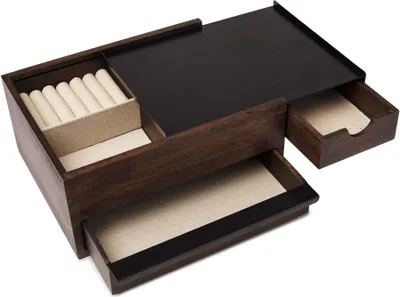 A wooden jewelry box with multiple drawers and compartments.