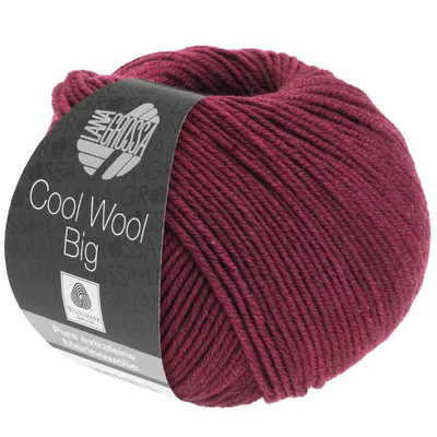 A ball of burgundy yarn with a label.