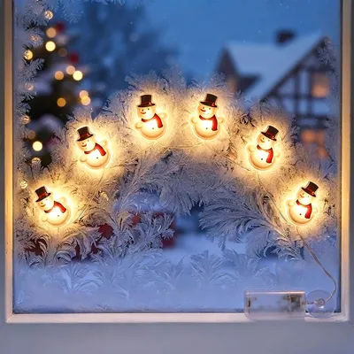 Produktbild von 1.01 Wiederverwendbare selbsthaftende SCHNEEMANN Fensteraufkleber - je ca. 8,5x6 cm - beleuchtet mit 6 LED
