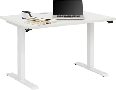 A white electric standing desk with a laptop and books on it, set against a white background.