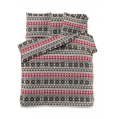 A folded duvet and pillow set with a festive pattern.
