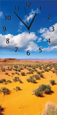 Produktbild von Wallario Design Wanduhr Wüste in Arizona - blauer Himmel mit Wolken I aus Echtglas, Größe 30 x 60 cm