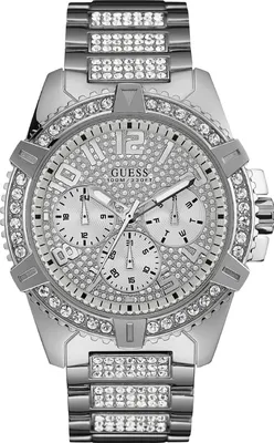 A close-up, studio shot of a men's Guess watch.