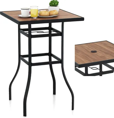 A square bistro table with a wood-grain top and black metal legs, set against a white background. A small inset shows a close-up of the tabletop with an umbrella hole.
