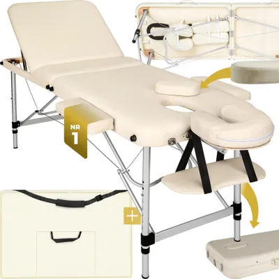 A cream-colored massage table with accessories, shown from a slightly elevated angle.