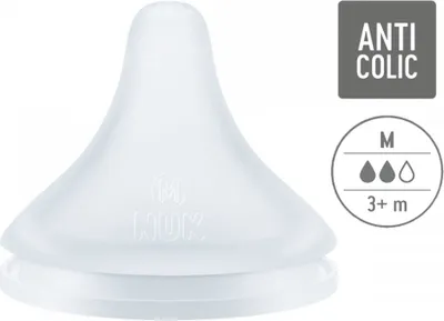 A close-up studio shot of a white NUK brand baby bottle nipple.