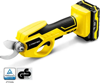 A yellow and black cordless electric pruning shear with a battery pack attached, shown against a white background. Two certification logos are visible in the bottom left corner.