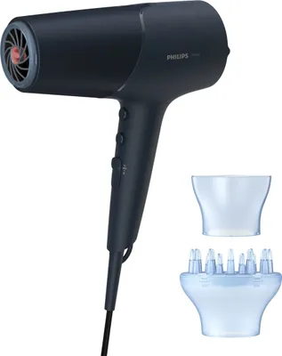A dark blue Philips hair dryer with two attachments is displayed against a white background.