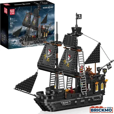 A black pirate ship model with sails and flags, displayed next to its packaging box.