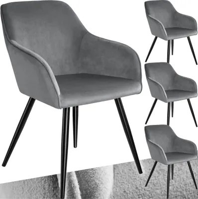 A collage of gray velvet dining chairs with black legs.
