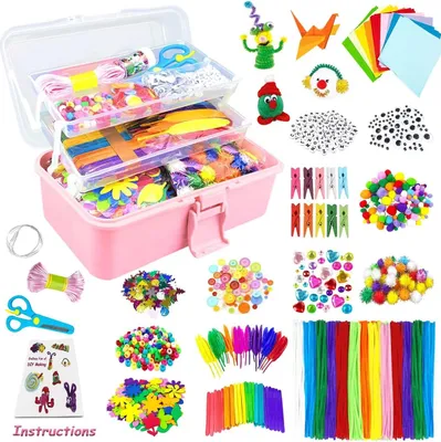 A craft kit for children, featuring a pink storage box filled with various craft supplies and additional items arranged around it.