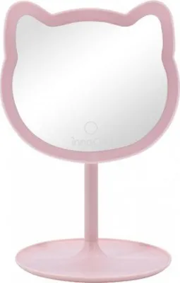 A pink cat-shaped makeup mirror with a stand.