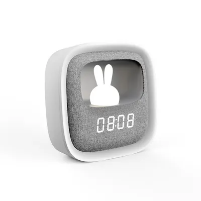 A digital alarm clock with a bunny design and a digital display.