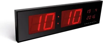 A digital LED wall clock displaying the time and date.