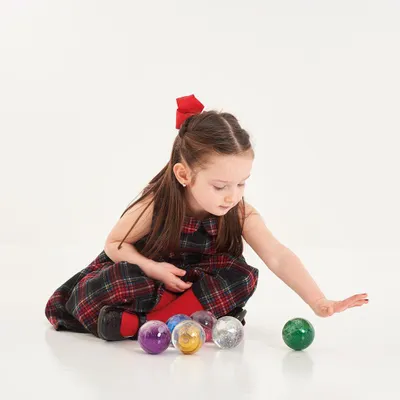 Immagine prodotto di Palline sensoriali glitterate TickiT - set arcobaleno con 7 palline