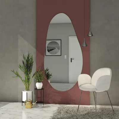 A modern living room with a large, irregularly shaped mirror as the centerpiece.