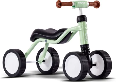 A light green Puky Wutsch balance bike for children is shown against a white background.