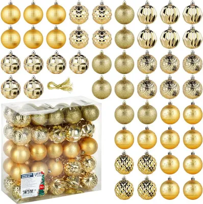 A collection of gold Christmas tree ornaments in various styles and a clear plastic box containing more ornaments.