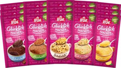 A collection of five RUF Glücklichmacher Tassenkuchen (mug cake) pouches, each displaying a different flavor.