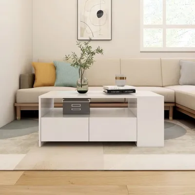 A modern living room scene with a couch, coffee table, and artwork.