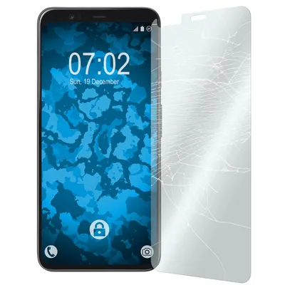 A smartphone with a cracked screen protector next to it.