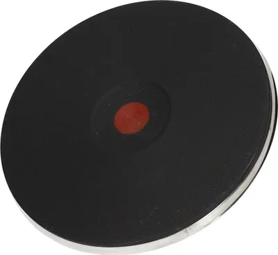 A single black electric stove burner with a red indicator light in the center.