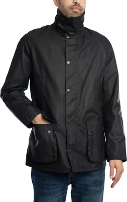 A man wearing a black jacket and blue jeans.