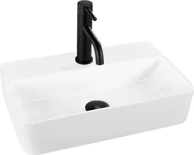 A white rectangular basin with a black faucet and drain.