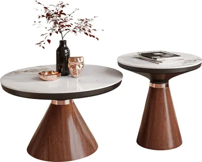 Two modern coffee tables with marble tops and wooden bases, decorated with a vase of branches, a decorative face, and an ashtray.