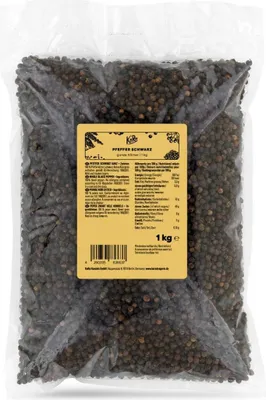A bag of whole black peppercorns with a product label.