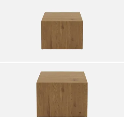 Two identical wooden cube-shaped coffee tables are shown against a white background.