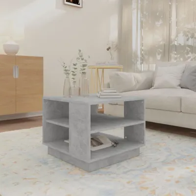 A living room scene with a coffee table in the foreground and a sofa in the background.