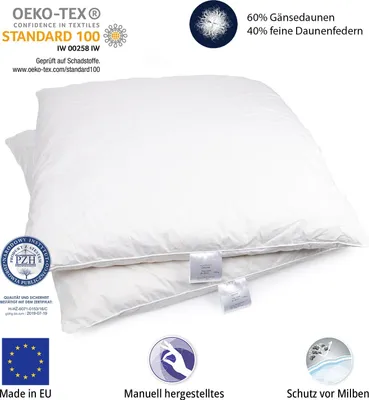 Two white pillows are stacked on top of each other, with various certification logos and text overlays.
