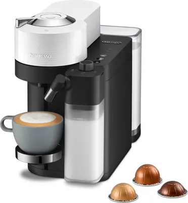A DeLonghi Nespresso coffee machine with a cup of coffee and coffee pods.