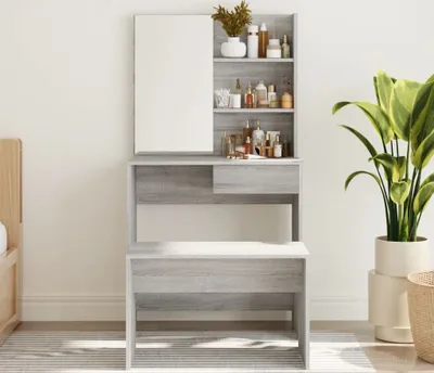 A vanity table with shelves and a mirror, filled with various bottles and containers, next to a large potted plant.