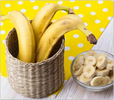 Produktbild von Spritzschutz Herdabdeckplatte Schneidebrett aus Glas Bananen in Korb 1-Teilig (60x52cm)