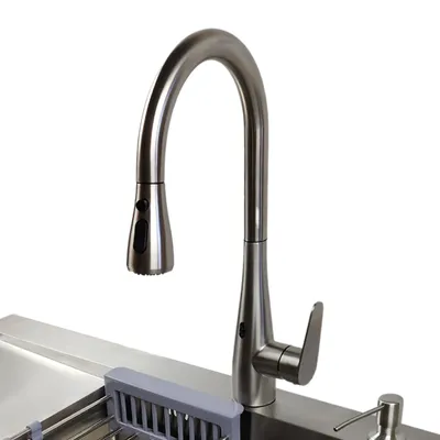 A close-up view of a modern kitchen faucet with a pull-out spout, mounted on a stainless steel sink.