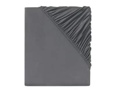 A close-up view of a gray fitted sheet, showing the elasticized corner.