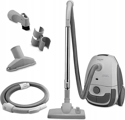 A vacuum cleaner and its accessories are displayed against a white background.