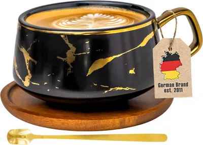 Produktbild von Intirilife Tasse aus Keramik im Marmor Design in Schwarz - ca. 200 ml - Kaffeetasse, Teetasse mit Holz Untersetzer Becher