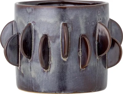 A close-up studio shot of a ceramic pot.