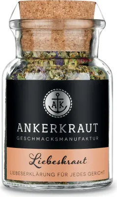 A glass jar of herbs with a cork lid and a label.
