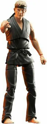 Obrázok produktu pre Cobra Kai Actionfigur Johnny Lawrence (18 cm)