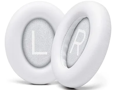 Two white ear pads for headphones, labeled 'L' and 'R'.