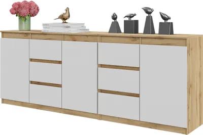A modern sideboard with white drawers and doors, set against a light wood frame, displayed on a white background.