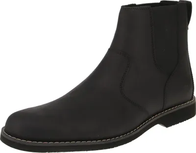 A black Chelsea boot is shown against a white background.