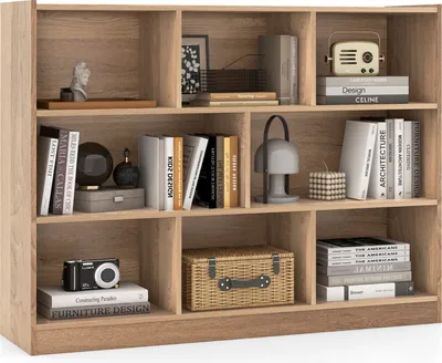 A wooden bookshelf filled with books and decorative items.