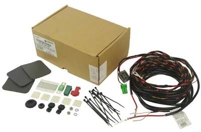 A product kit for a car's electrical system, including a wiring harness, connectors, and a box.
